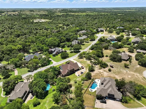 a view of a patio with table and chairs potted plants