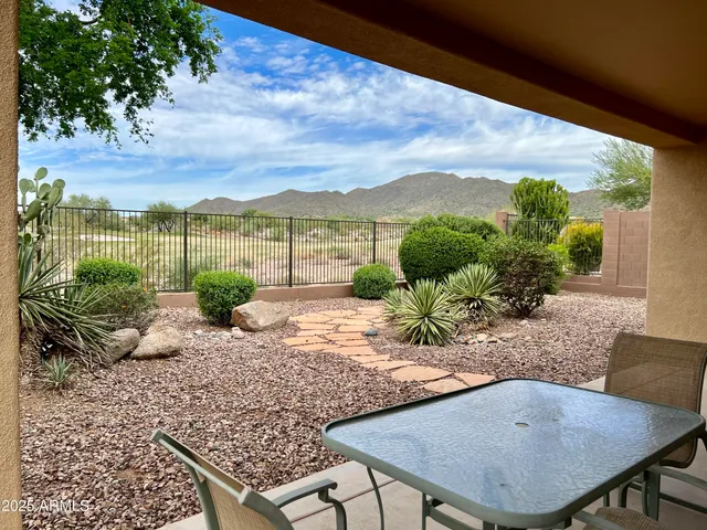 a view of a couches and table in the patio