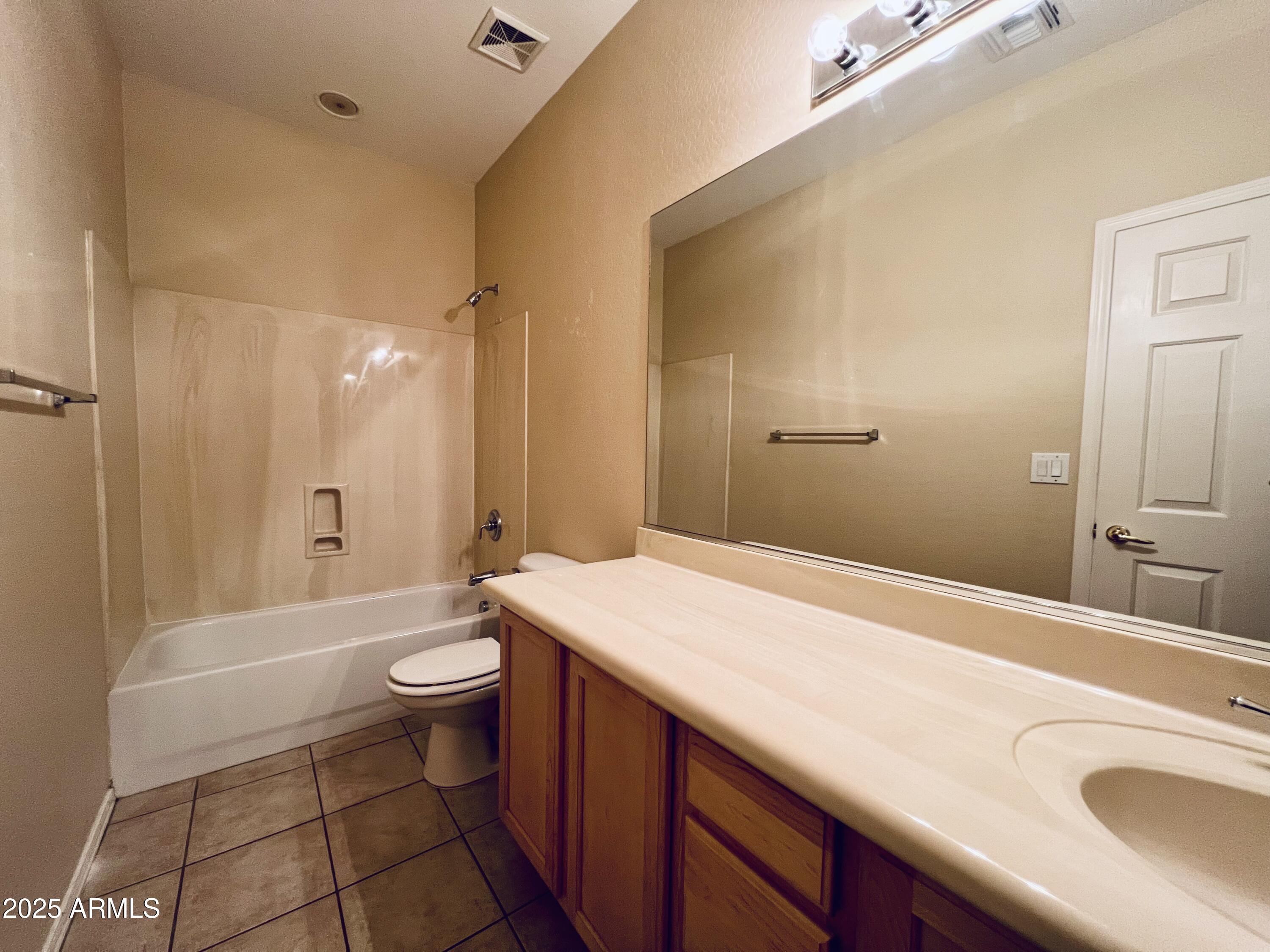 41018 North Prestancia Way Anthem, AZ 85086 - Photo 17 of 29 a bathroom with a sink a toilet and shower
