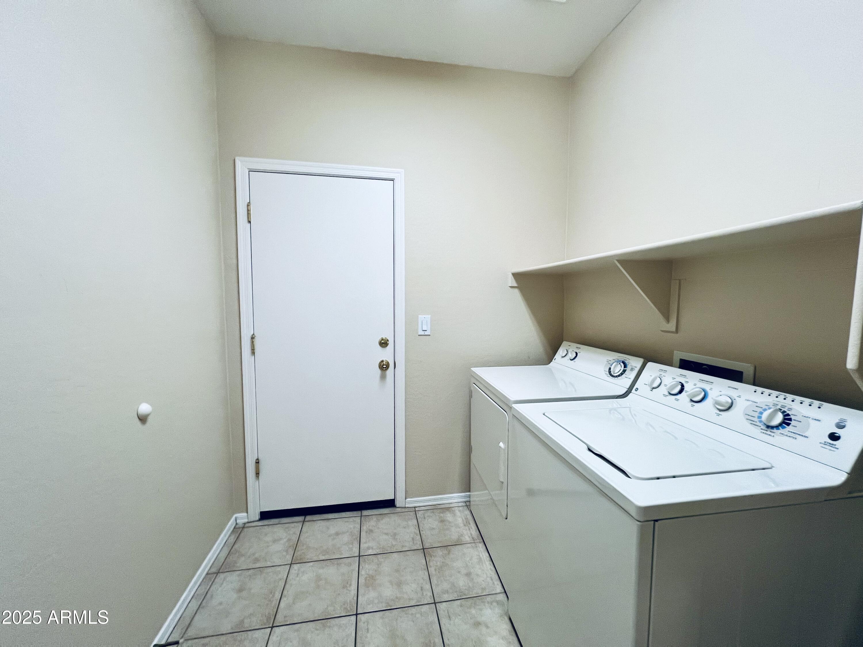 41018 North Prestancia Way Anthem, AZ 85086 - Photo 18 of 29 a utility room with dryer and washer