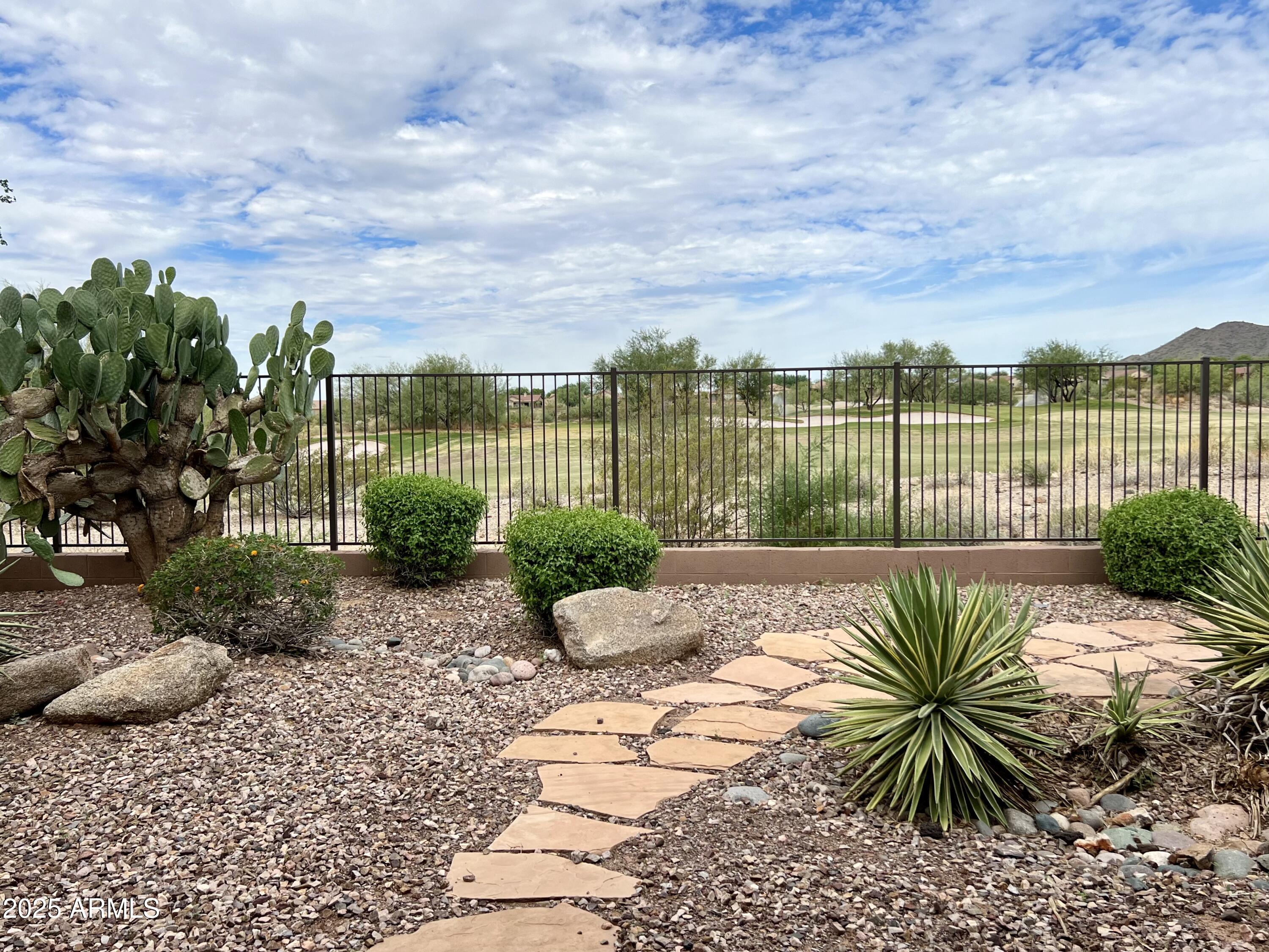 41018 North Prestancia Way Anthem, AZ 85086 - Photo 8 of 29 a view of a lake with a garden