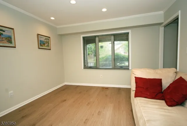 a living room with a couch and a window