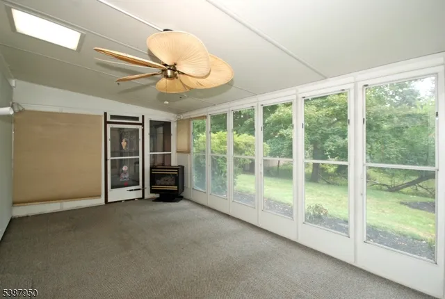 a view of an empty room with a sliding door