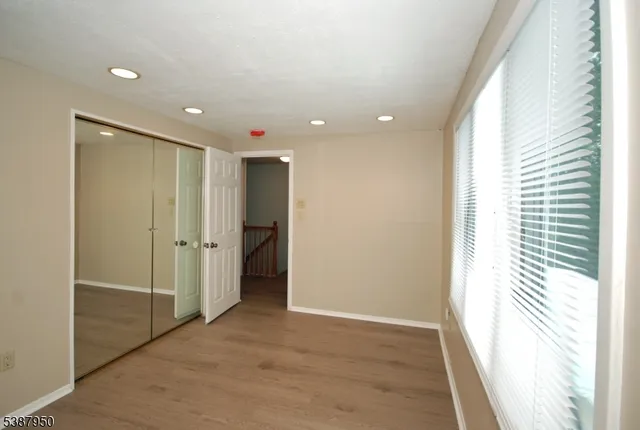 a bathroom with a sink a toilet and a window
