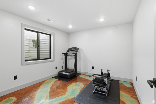 175 North 100 West Providence, UT 84332 - Photo 28 of 45 Bedroom used as an exercise area with recessed lighting and finished concrete floors