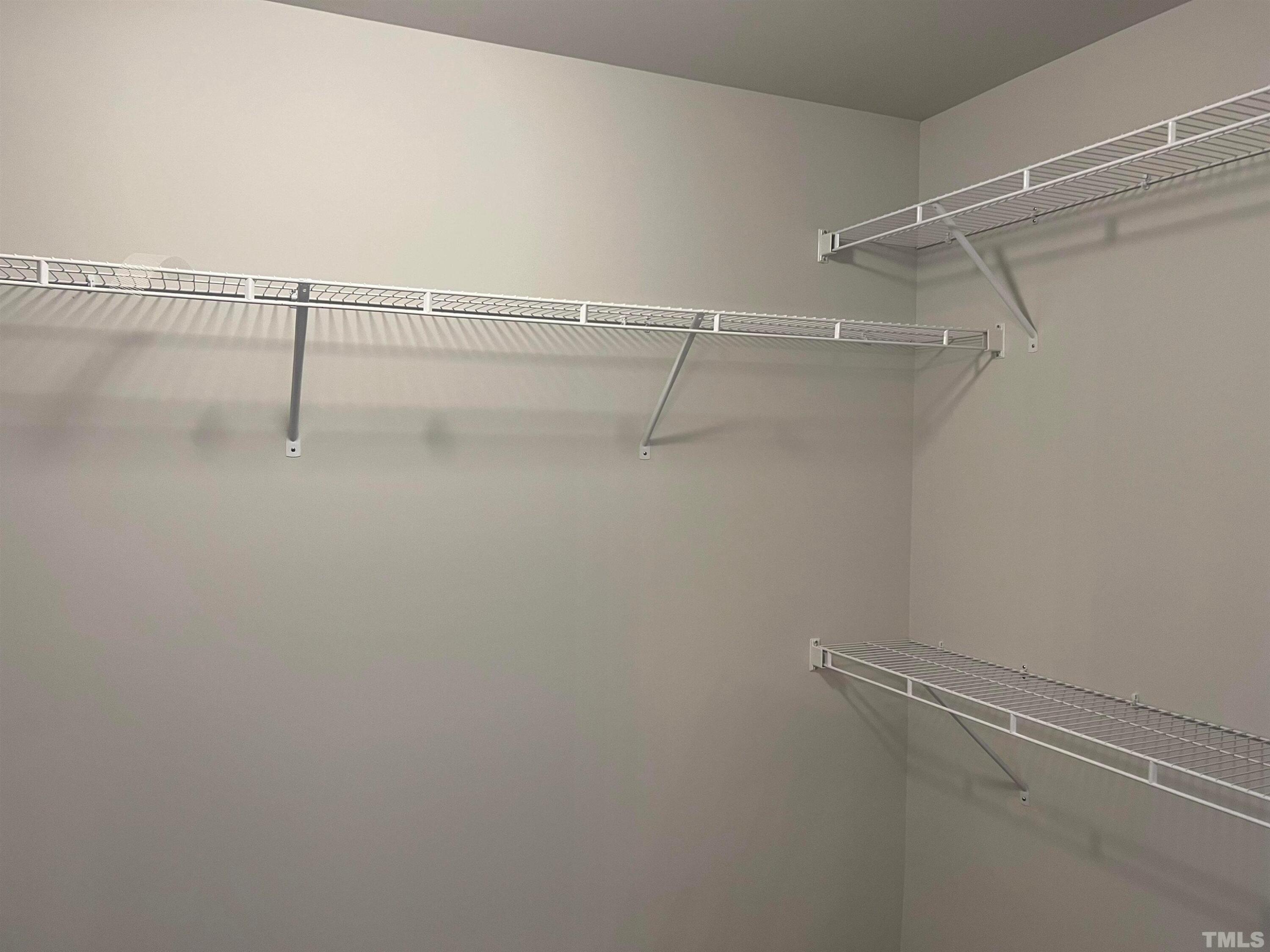 179 Maple Tree Lane Clayton, NC 27527 - Photo 13 of 18 a view of a room with racks on the wall