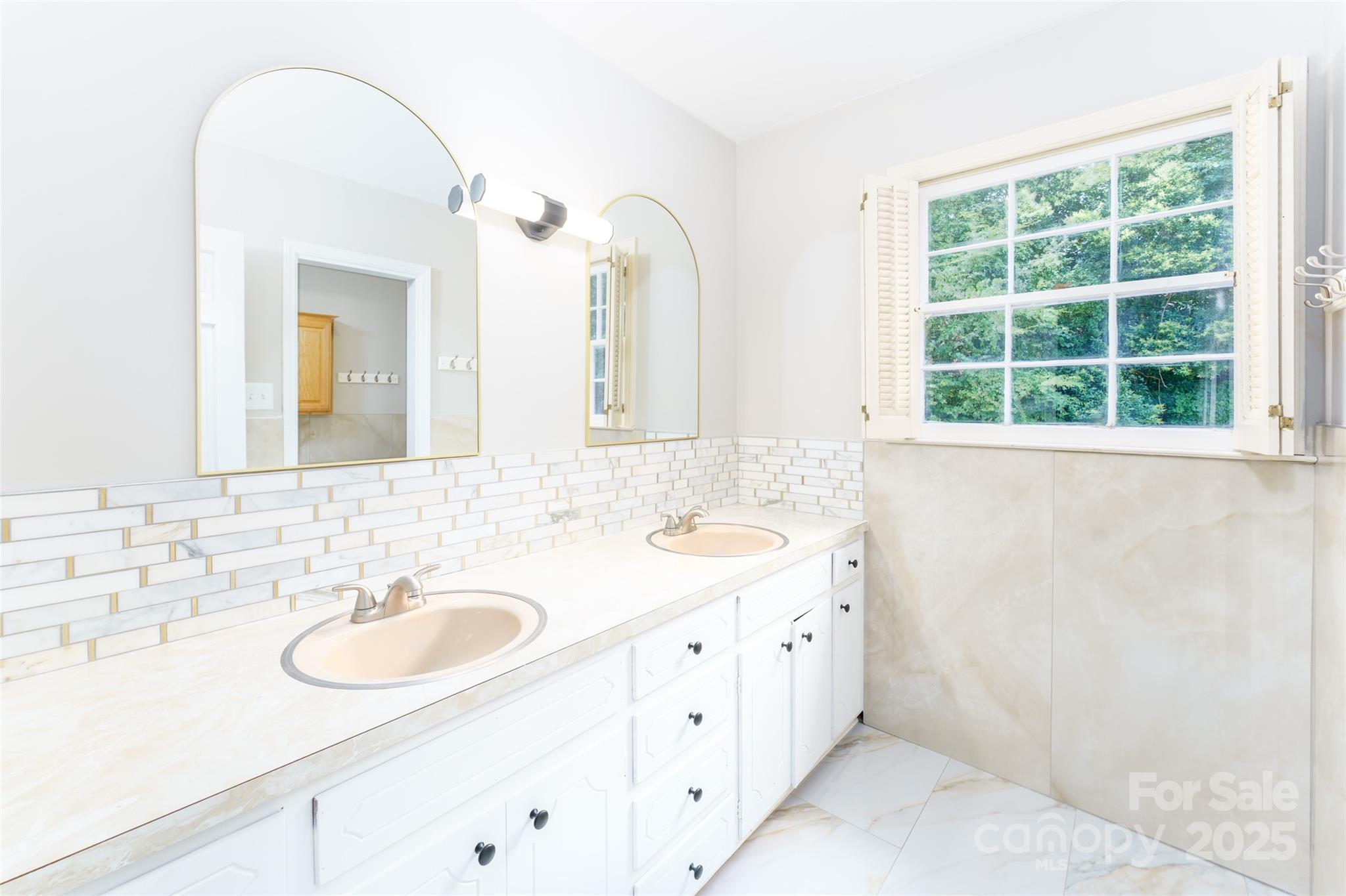 1728 Colony Road Salisbury, NC 28144 - Photo 5 of 20 a bathroom with a double vanity sink and a mirror