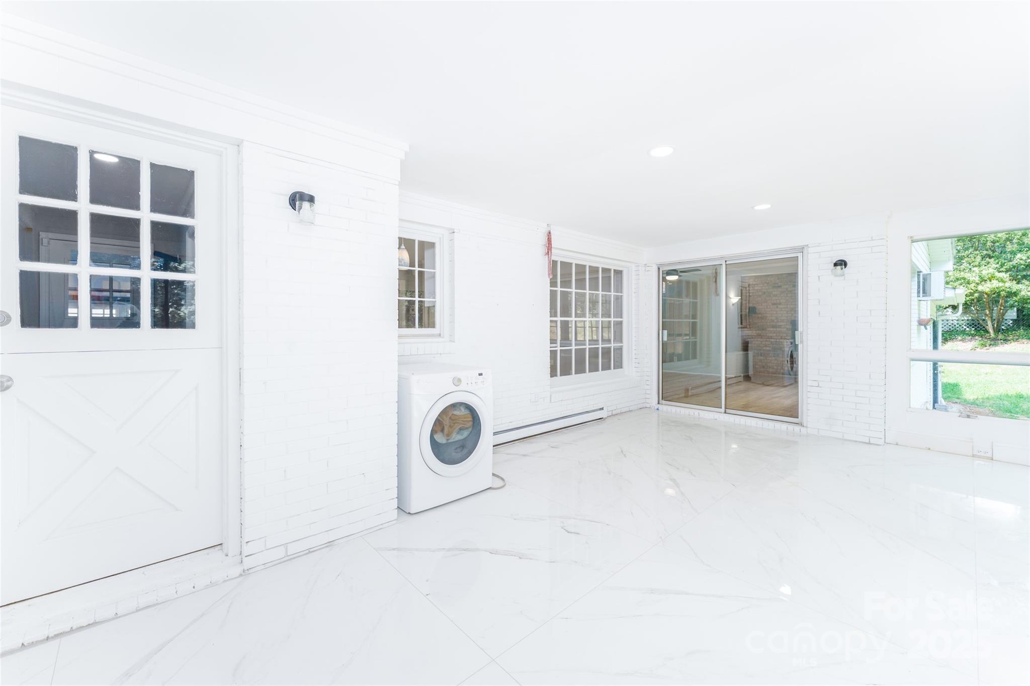 1728 Colony Road Salisbury, NC 28144 - Photo 7 of 20 an empty room with windows and entrance