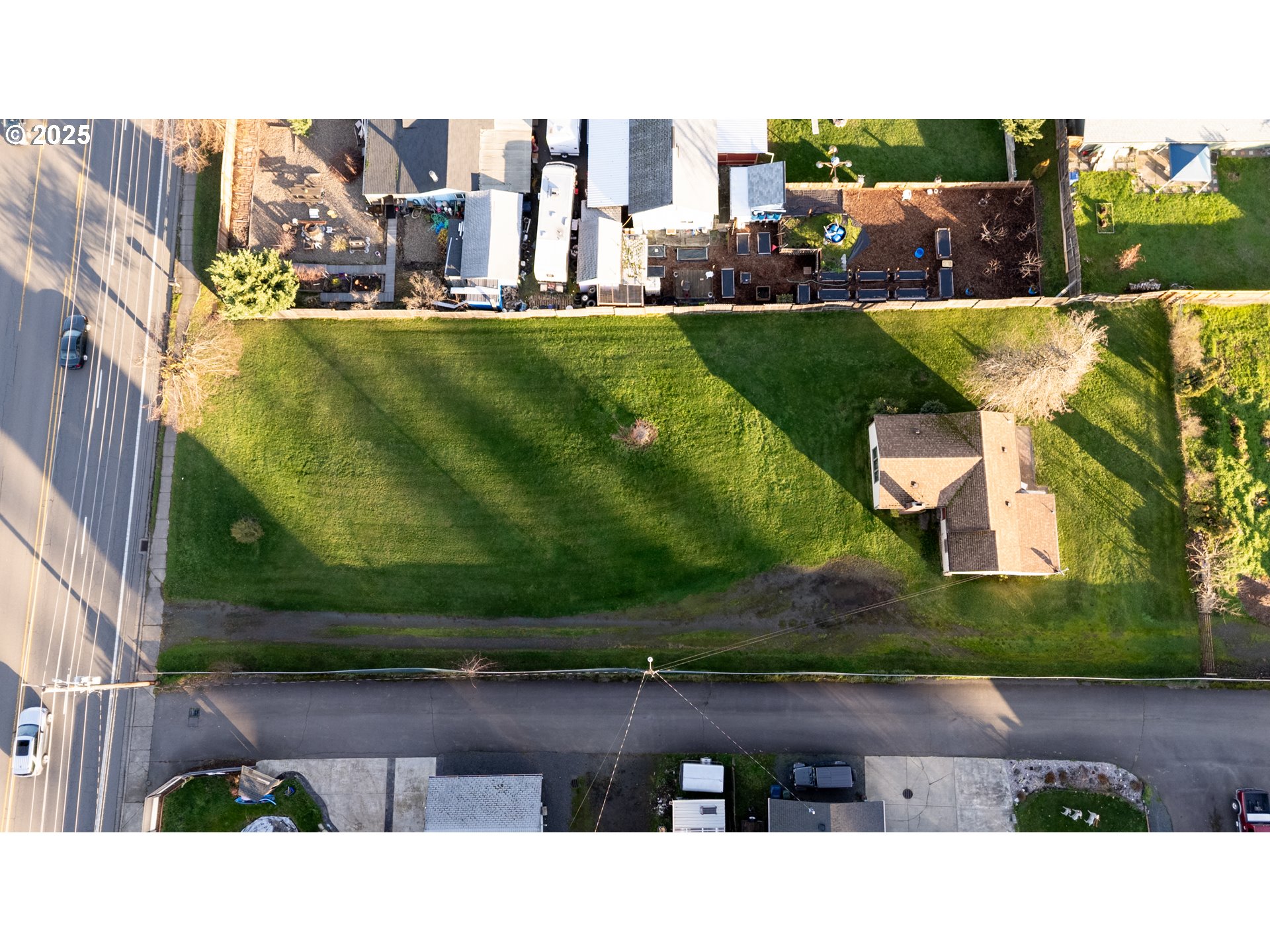 6981 Main Street Springfield, OR 97478 - Photo 3 of 8 an aerial view of a house with a yard