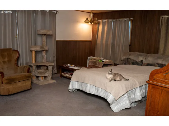 a living room with furniture and a closet