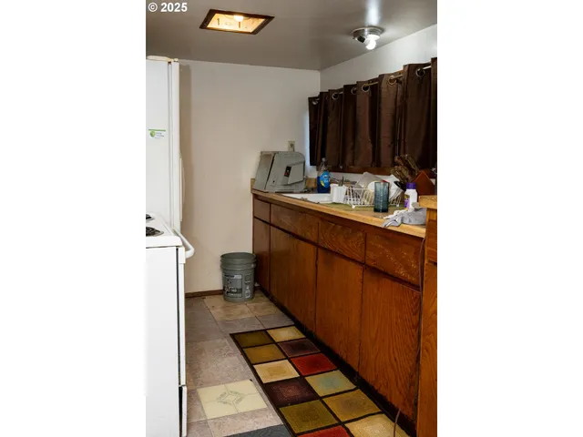 a room with a sink and a mirror