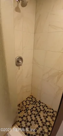 a white toilet sitting next to a toilet