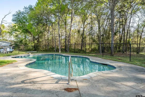 a view of swimming pool with a patio