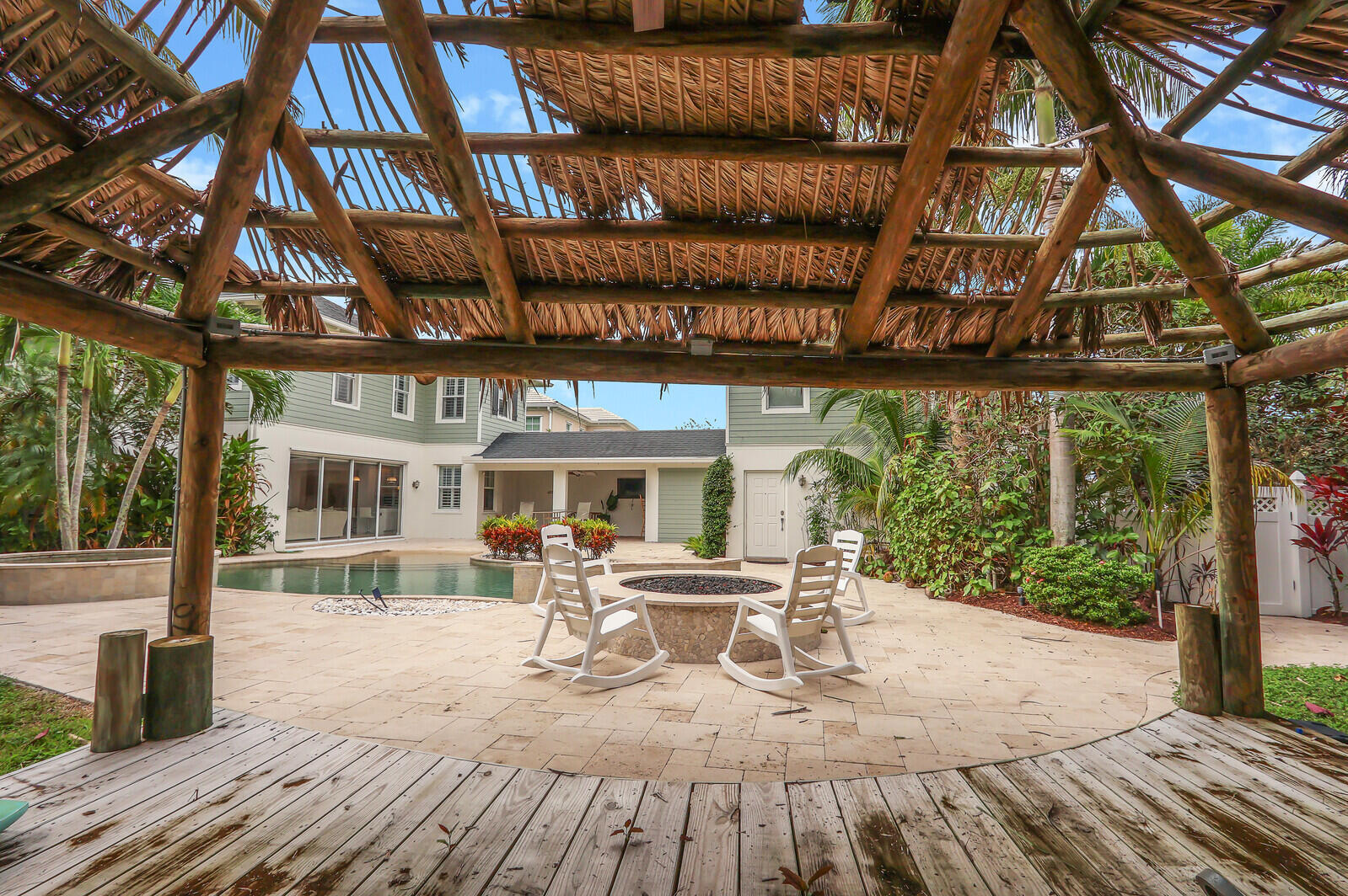 101 St Pierre Way Jupiter, FL 33458 - Photo 55 of 57 a view of a patio with table and chairs and wooden floor