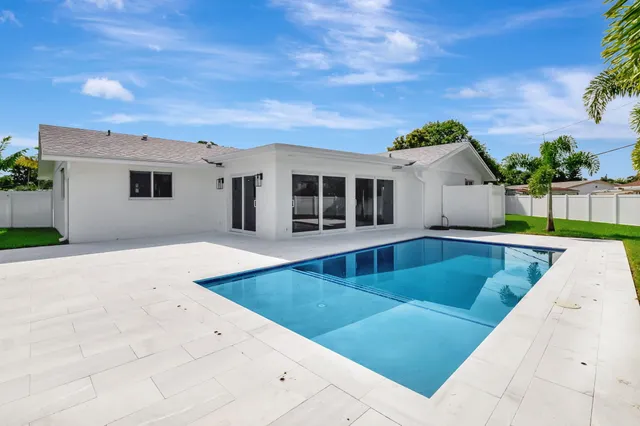 a view of swimming pool with a yard