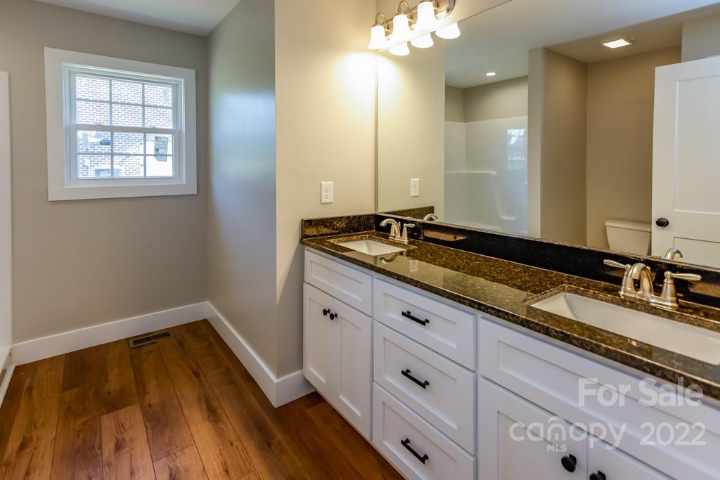 136 Augusta Drive Spindale, NC 28160 - Photo 14 of 19 a bathroom with a granite countertop sink and a mirror