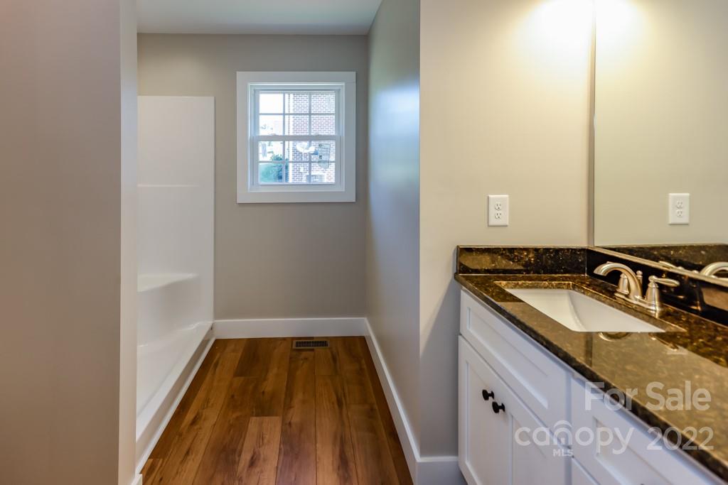 136 Augusta Drive Spindale, NC 28160 - Photo 15 of 19 a bathroom with a granite countertop sink
