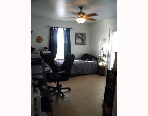 210 Oak Ridge Drive Corpus Christi, TX 78418 - Photo 6 of 10 a view of a livingroom with workspace and a window