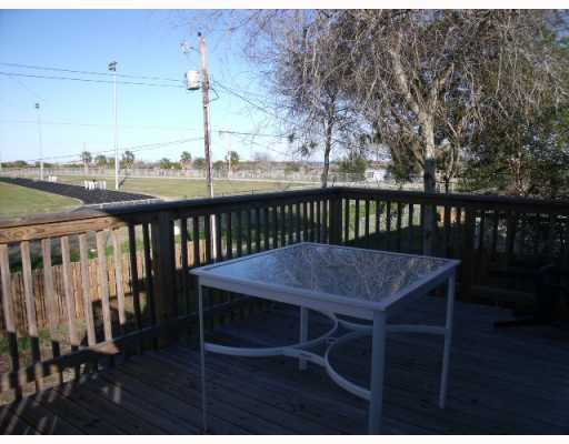 210 Oak Ridge Drive Corpus Christi, TX 78418 - Photo 8 of 10 a view of balcony with wooden floor and outdoor seating