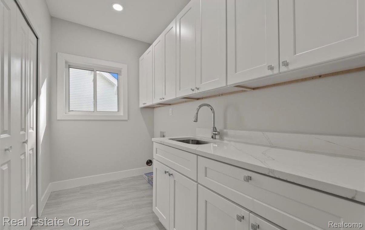 5636 Paris Street Sterling Heights, MI 48310 - Photo 25 of 37 Laundry room with cabinet space and recessed lighting