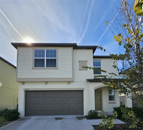 a front view of a house with a garage