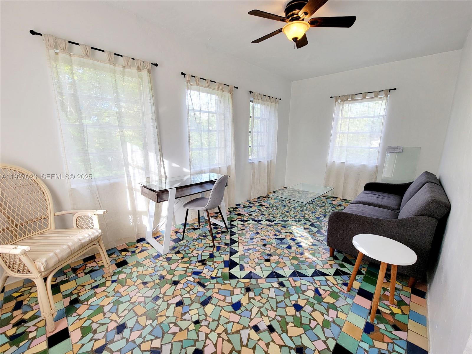 1872 Southwest 9th Street Miami, FL 33135 - Photo 11 of 48 a living room with furniture and a chandelier