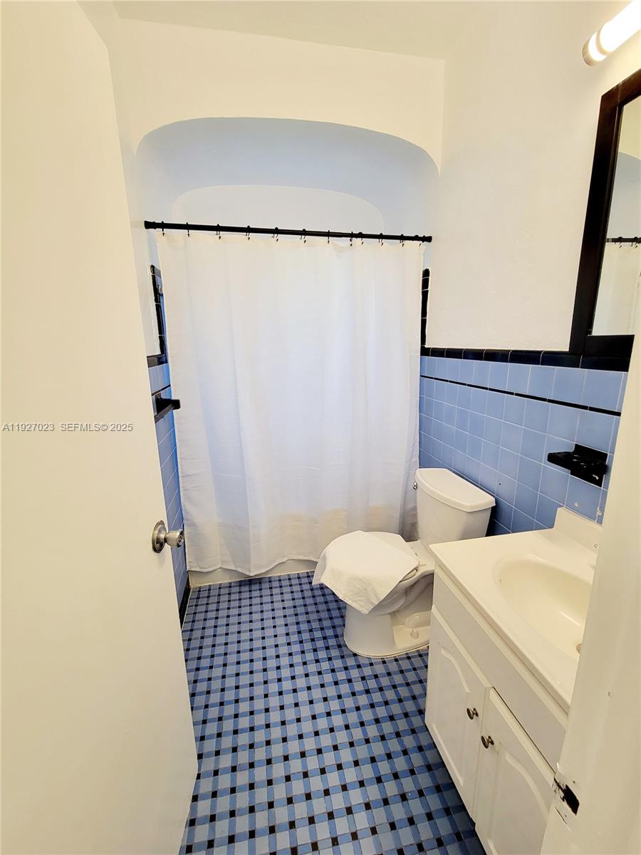 1872 Southwest 9th Street Miami, FL 33135 - Photo 13 of 48 a bathroom with a sink and a mirror