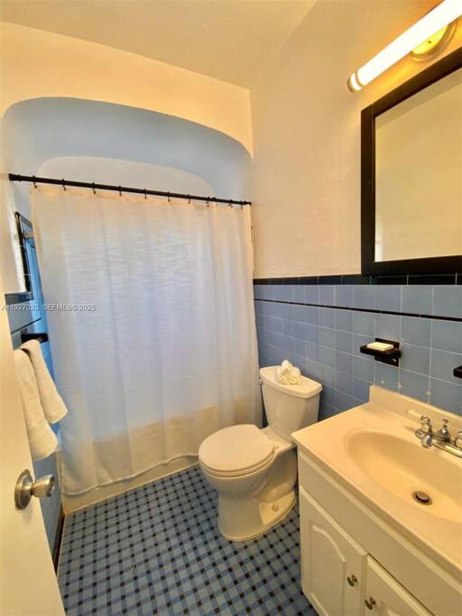 1872 Southwest 9th Street Miami, FL 33135 - Photo 14 of 48 a bathroom with a sink and a toilet