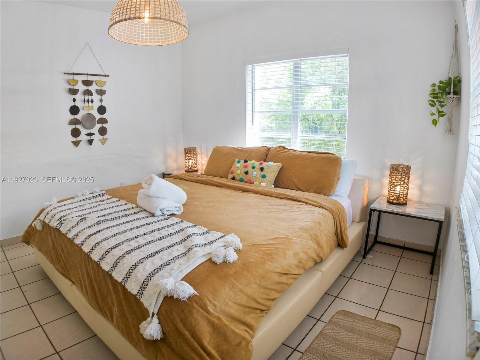 1872 Southwest 9th Street Miami, FL 33135 - Photo 22 of 48 a bedroom with a bed and a window