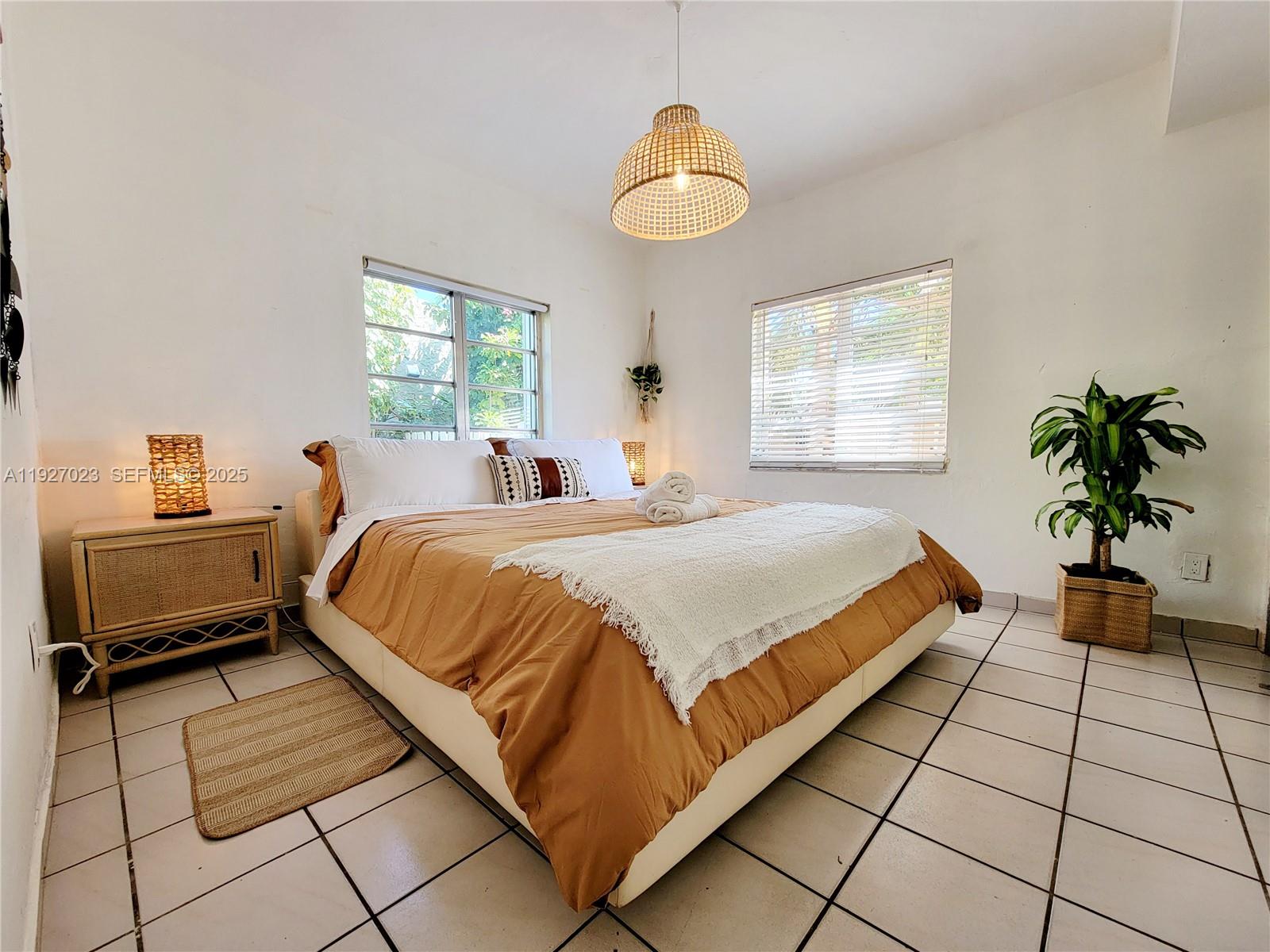 1872 Southwest 9th Street Miami, FL 33135 - Photo 23 of 48 a bedroom with a bed and a window
