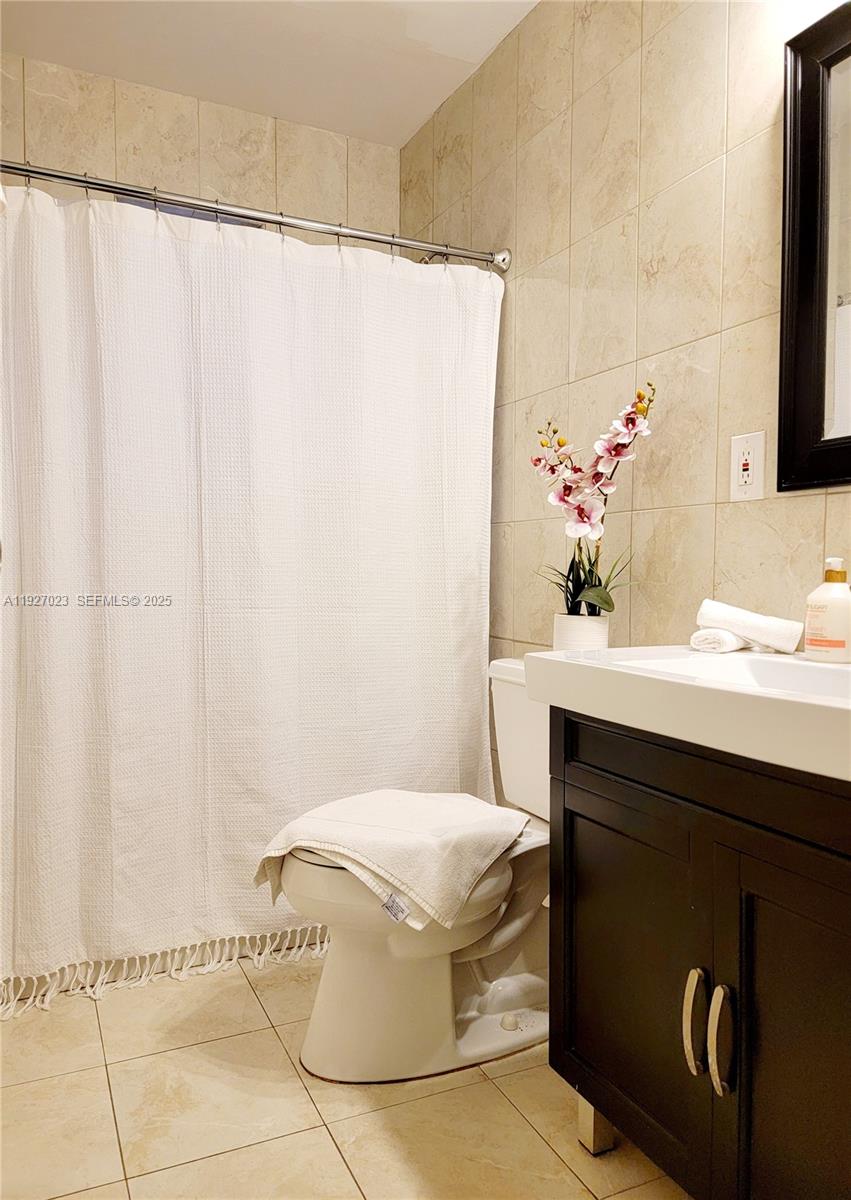 1872 Southwest 9th Street Miami, FL 33135 - Photo 24 of 48 a bathroom with a sink and a mirror