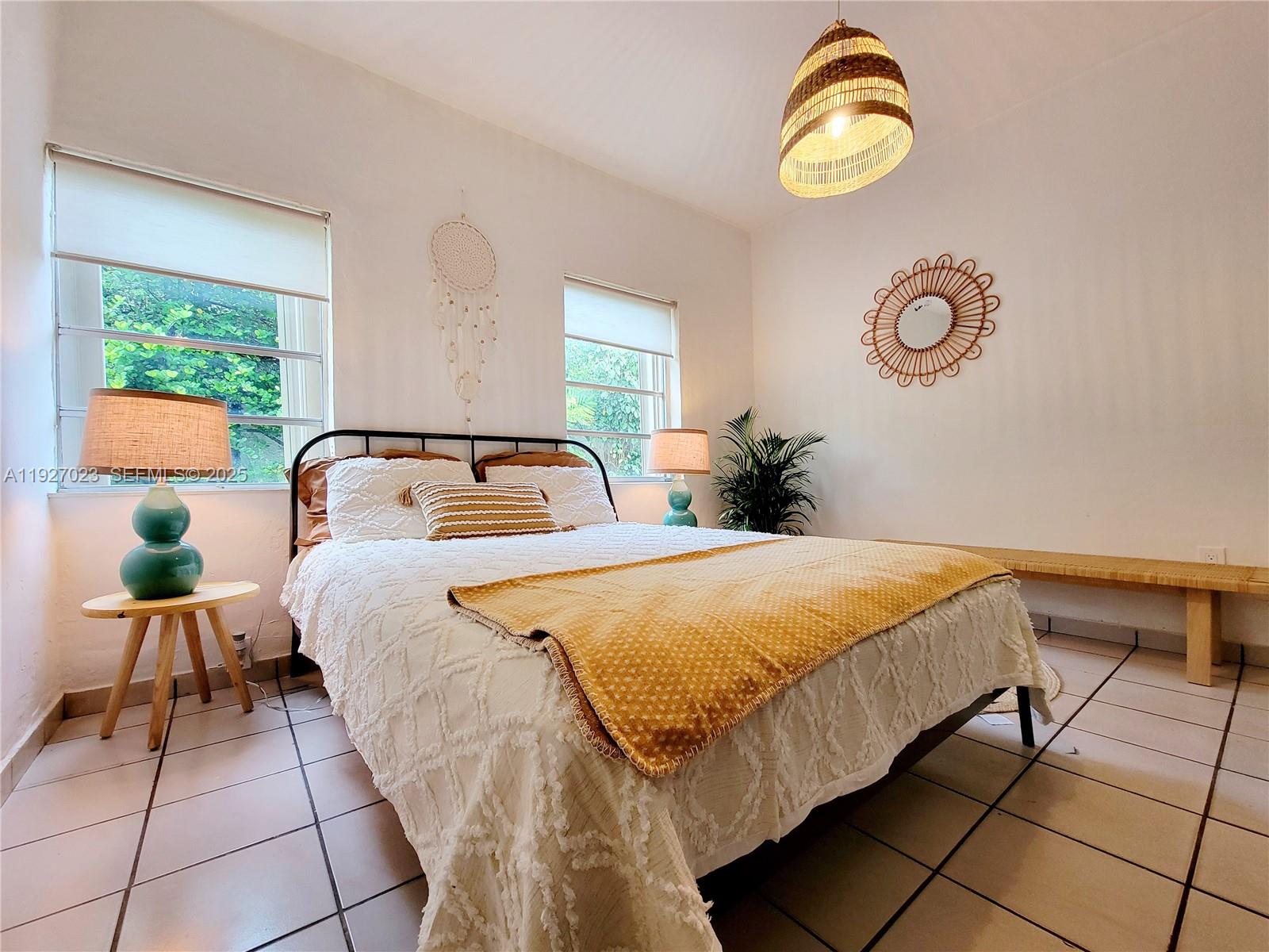 1872 Southwest 9th Street Miami, FL 33135 - Photo 26 of 48 a bedroom with a bed and window