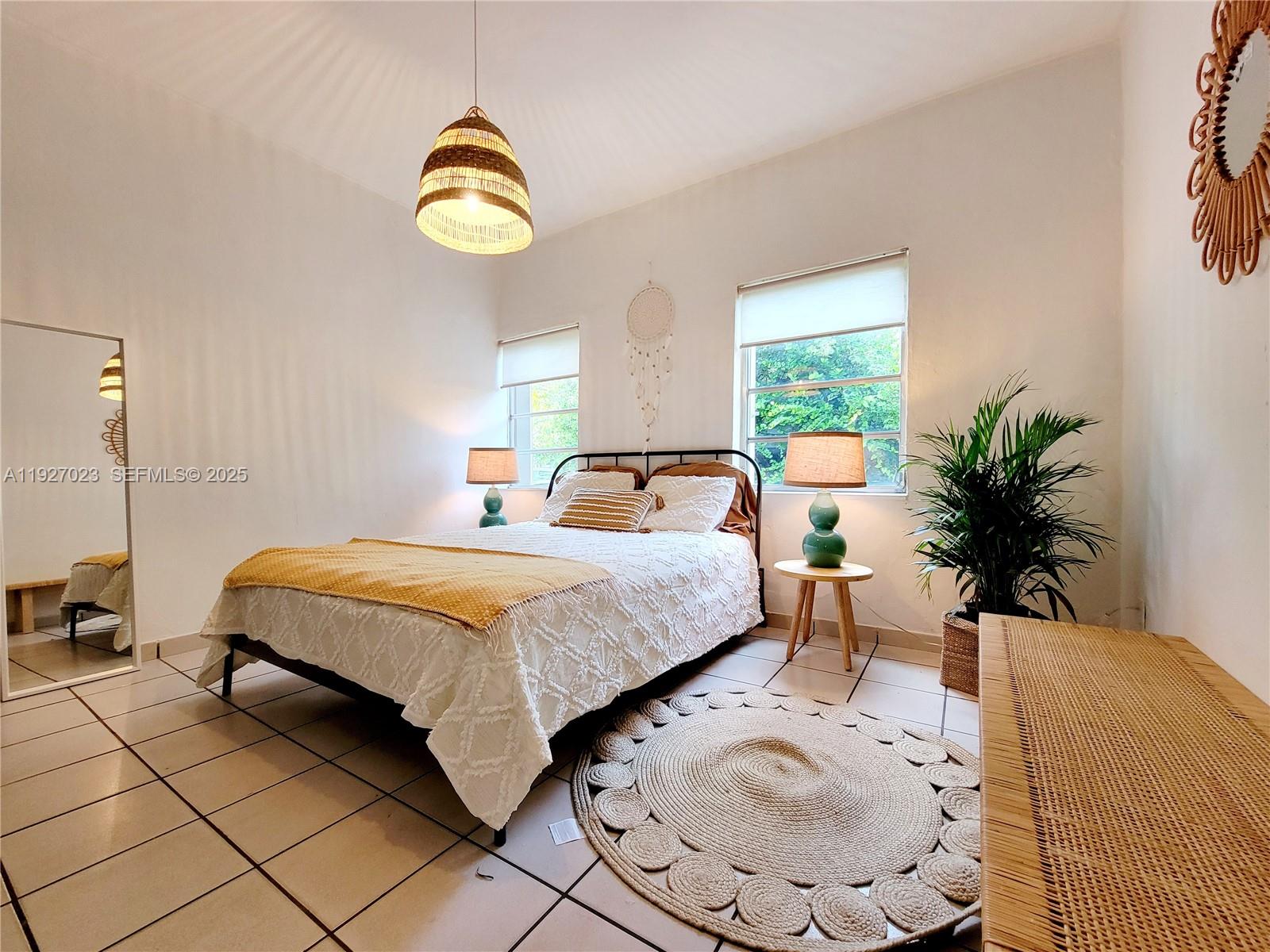 1872 Southwest 9th Street Miami, FL 33135 - Photo 27 of 48 a bedroom with bed and a window