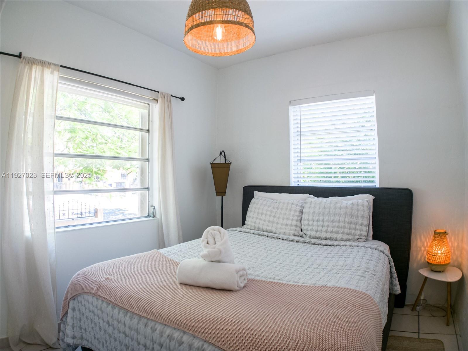 1872 Southwest 9th Street Miami, FL 33135 - Photo 29 of 48 a bedroom with a bed and window