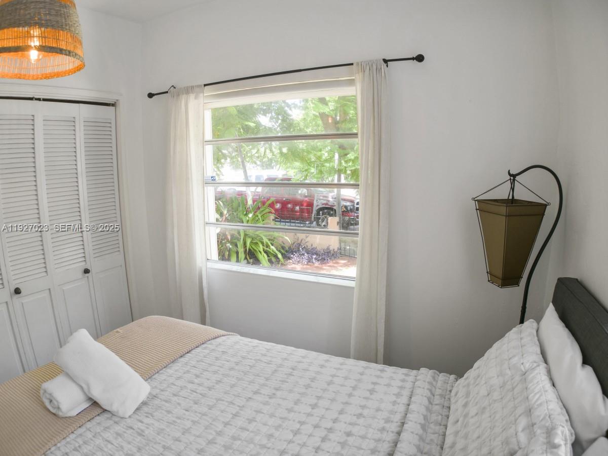 1872 Southwest 9th Street Miami, FL 33135 - Photo 30 of 48 a bedroom with a bed and a window