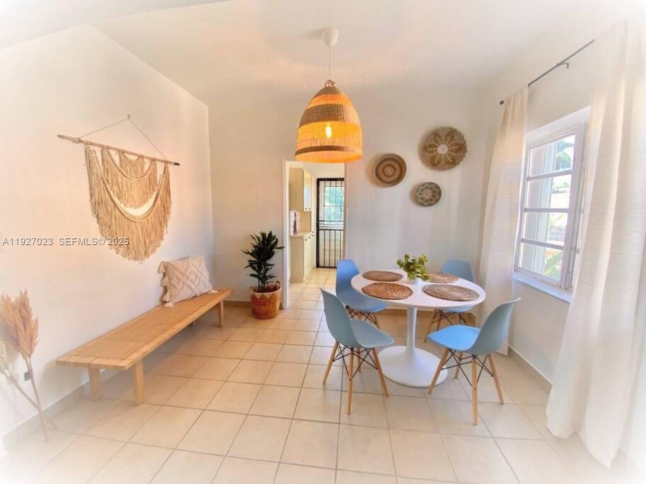 1872 Southwest 9th Street Miami, FL 33135 - Photo 3 of 48 a view of a dining room with furniture and chandelier