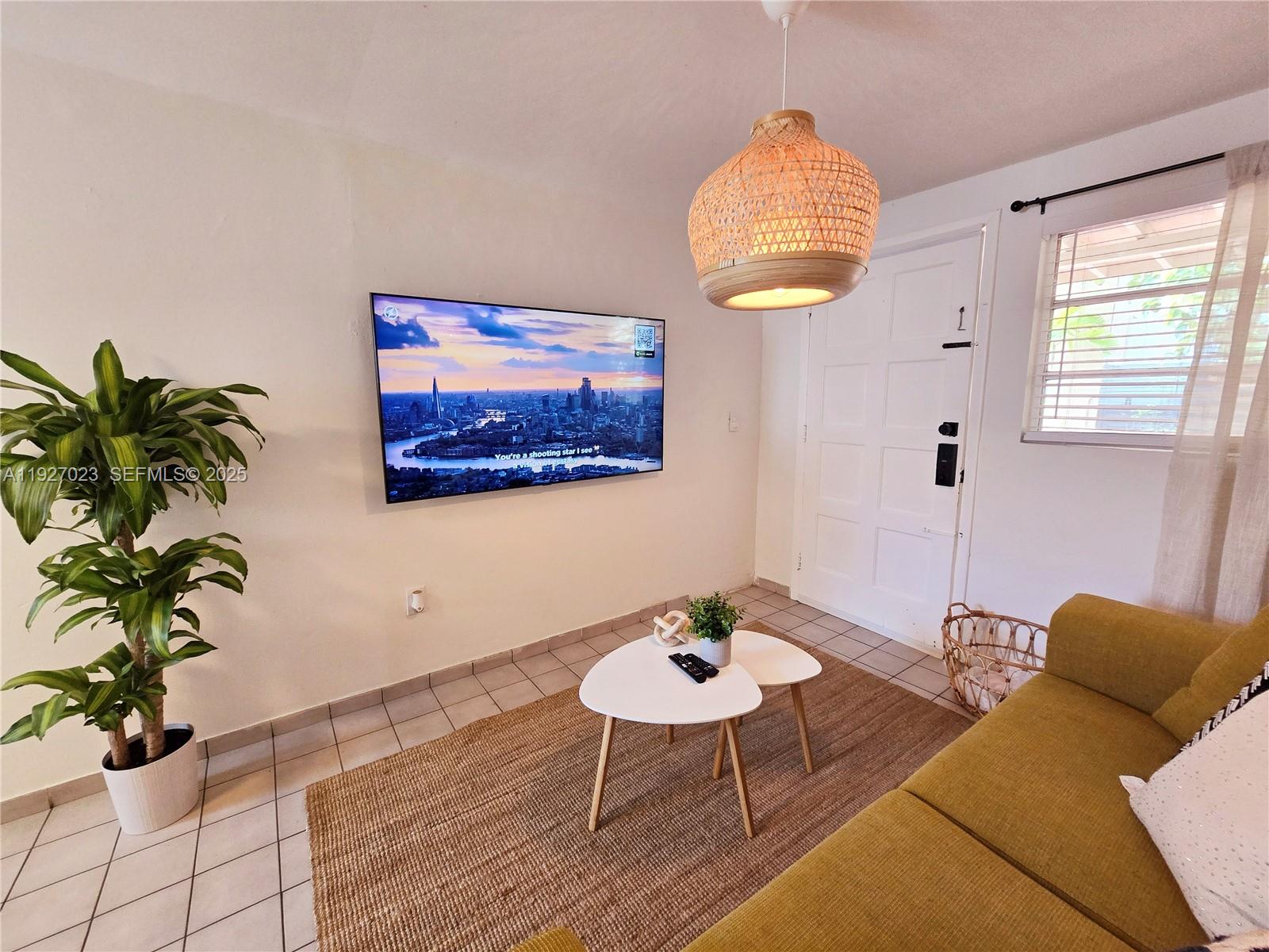 1872 Southwest 9th Street Miami, FL 33135 - Photo 32 of 48 a living room with furniture and a potted plant