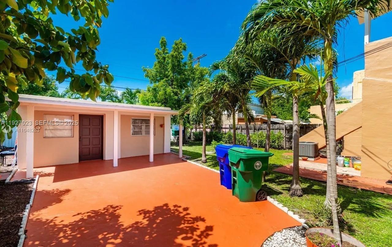 1872 Southwest 9th Street Miami, FL 33135 - Photo 41 of 48 a front view of a house with garden and patio