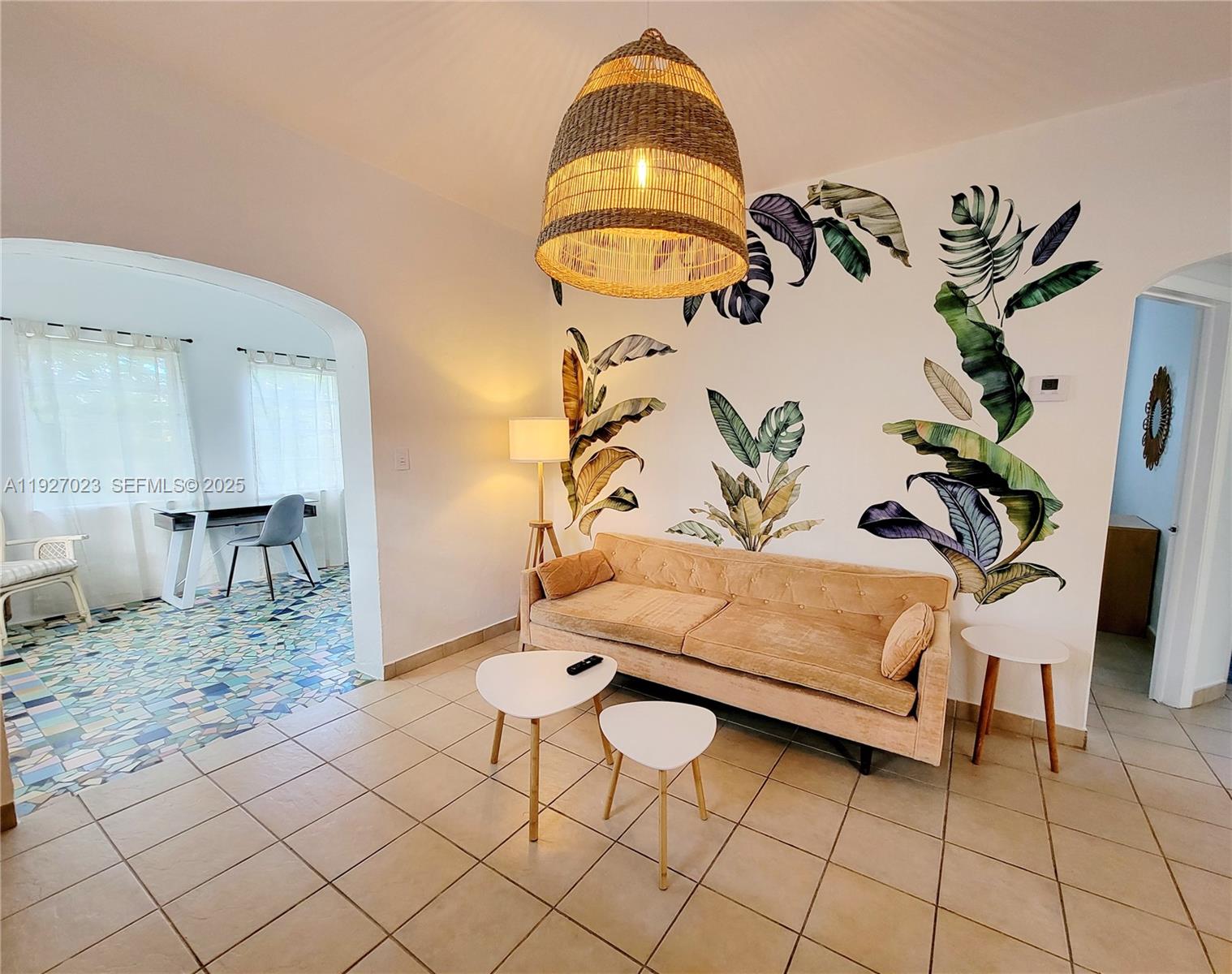 1872 Southwest 9th Street Miami, FL 33135 - Photo 6 of 48 a living room with a couch and a potted plant