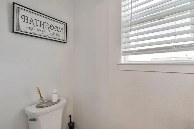 a view of a hallway with a window