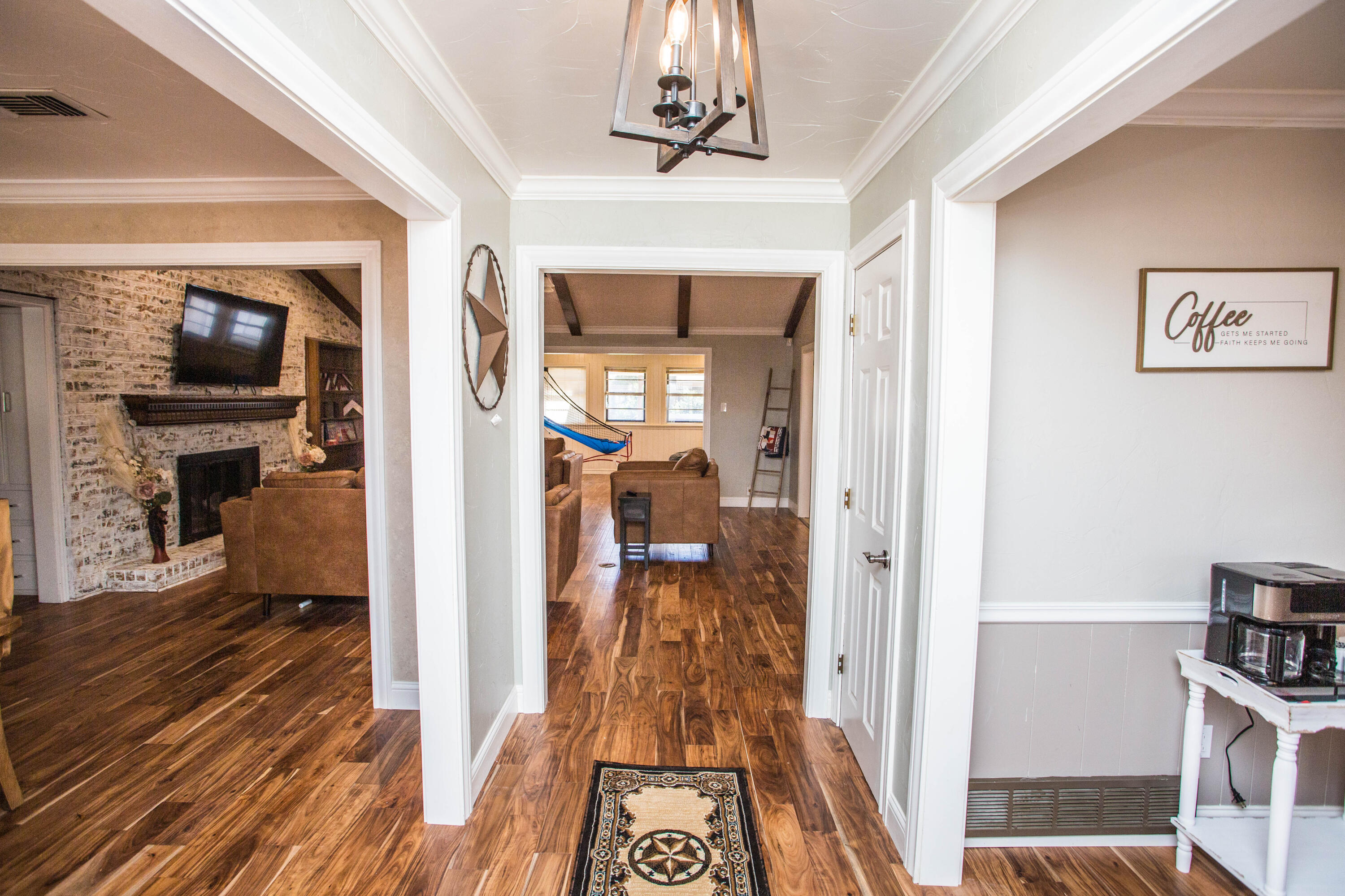 5407 79th Street Lubbock, TX 79424 - Photo 3 of 19 a view of a hallway view with wooden floor and furniture