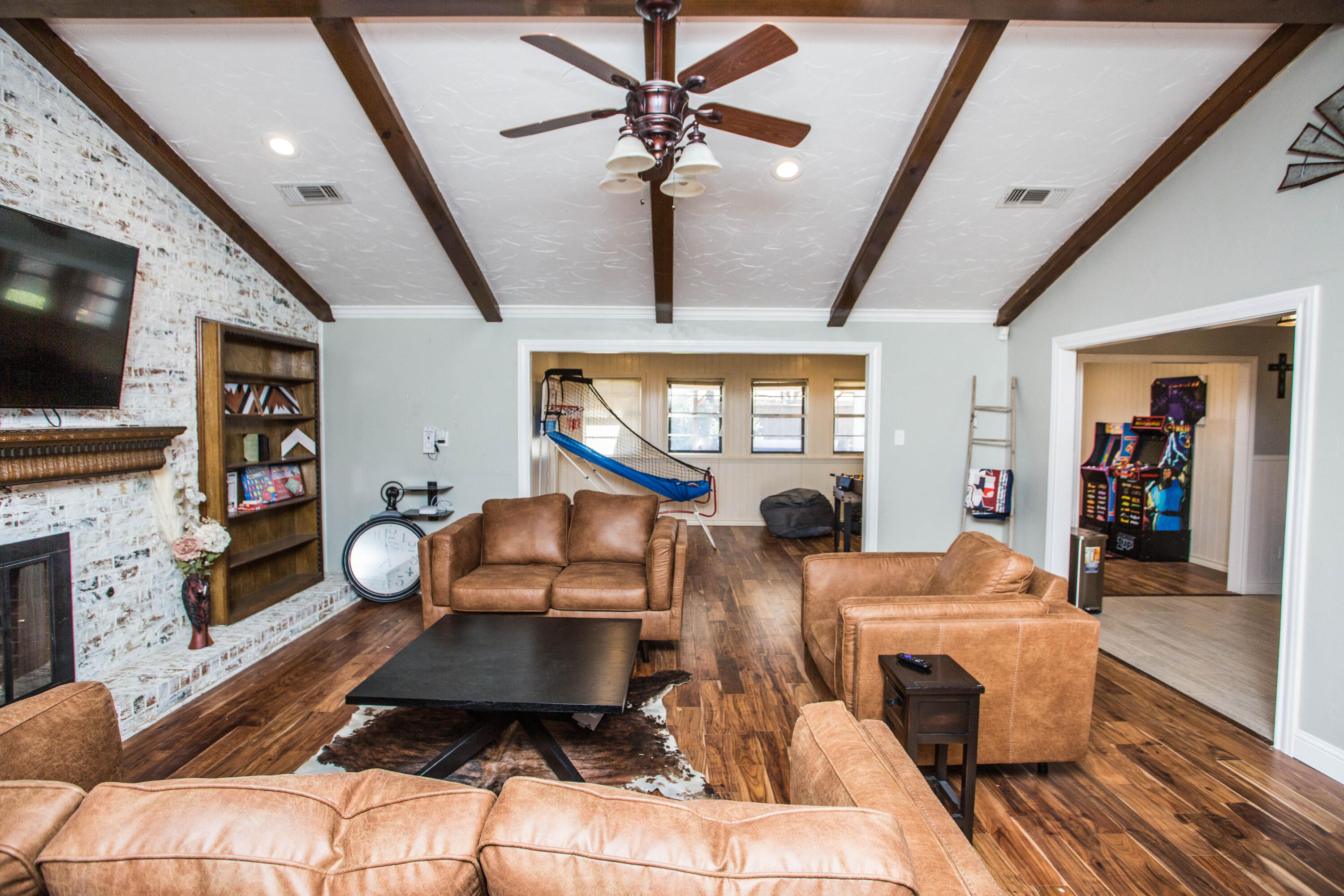 5407 79th Street Lubbock, TX 79424 - Photo 5 of 19 a room with furniture a flat screen tv and a fireplace