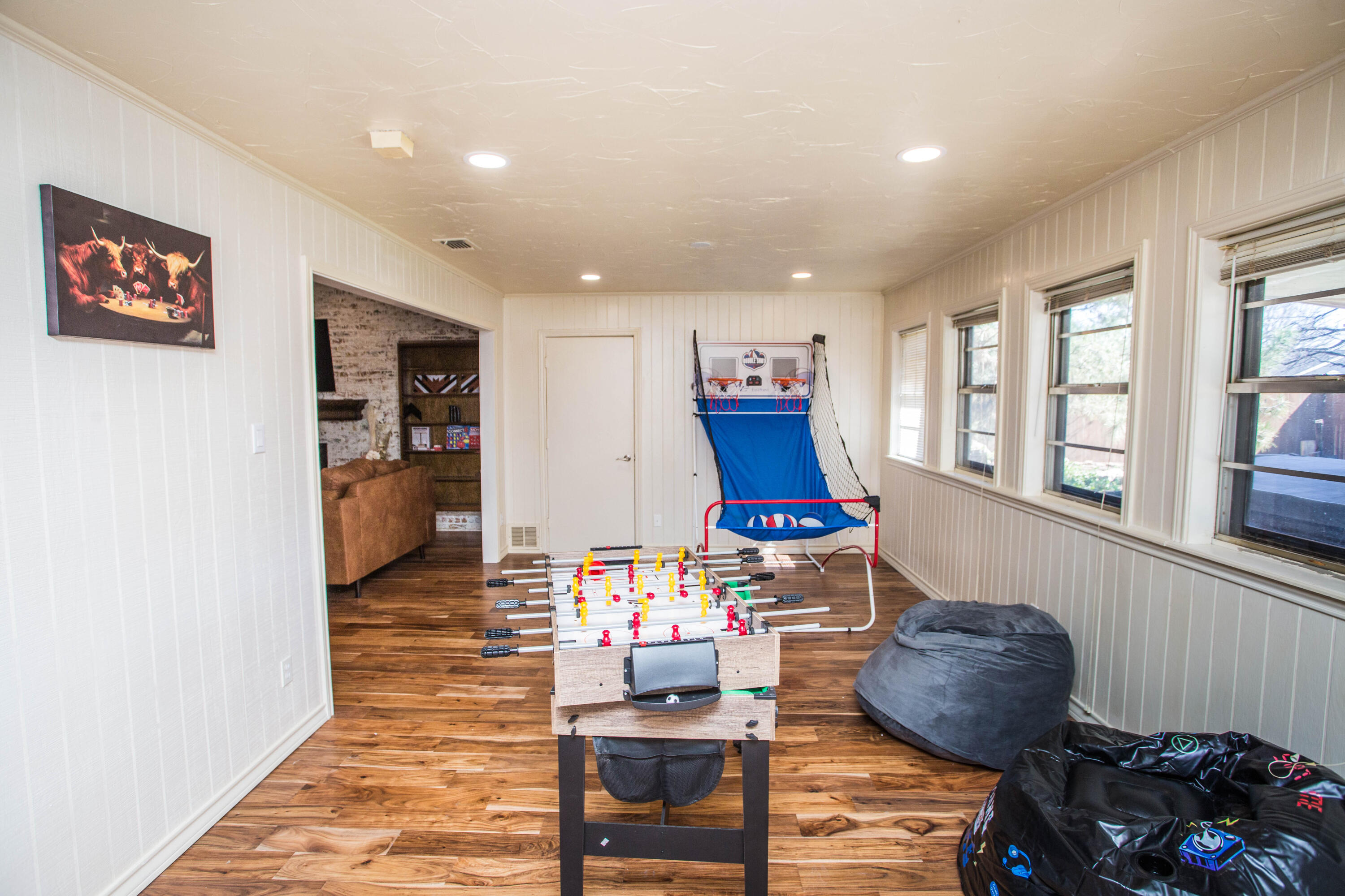 5407 79th Street Lubbock, TX 79424 - Photo 10 of 19 a living room with furniture and a wooden floor