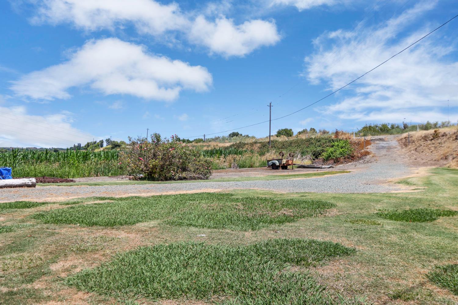 15370 Andrus Island Road Isleton, CA 95641 - Photo 67 of 67 Driveway to rental house. The house has it's own domestic well, and septic, also its own propane tank which is owned. A new roof was put on within the last 3 years with a permit and final inspection.