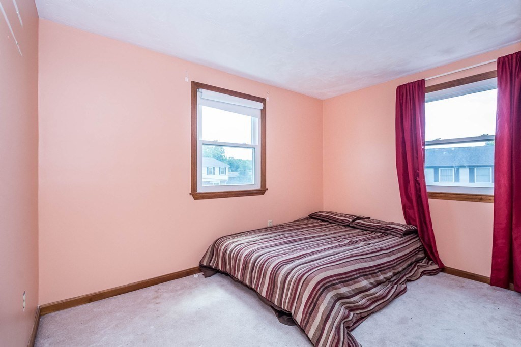 2 Fred Dolan Circle, Unit 2 Randolph, MA 02368 - Photo 14 of 25 a bedroom with a bed and a window