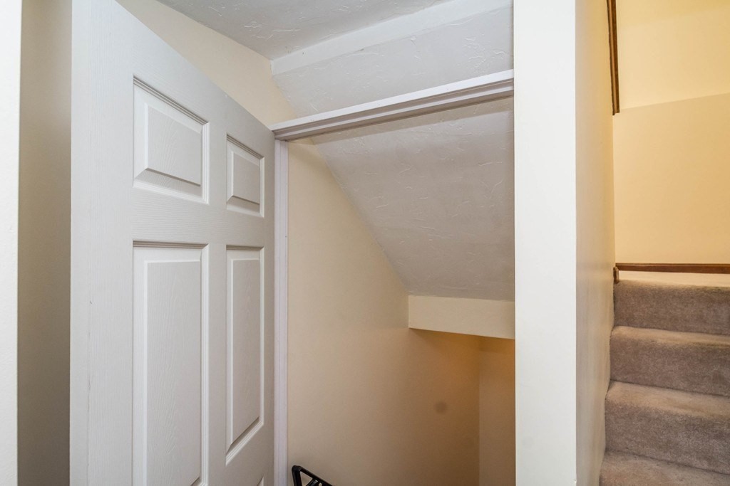 2 Fred Dolan Circle, Unit 2 Randolph, MA 02368 - Photo 19 of 25 a bathroom with a glass shower door