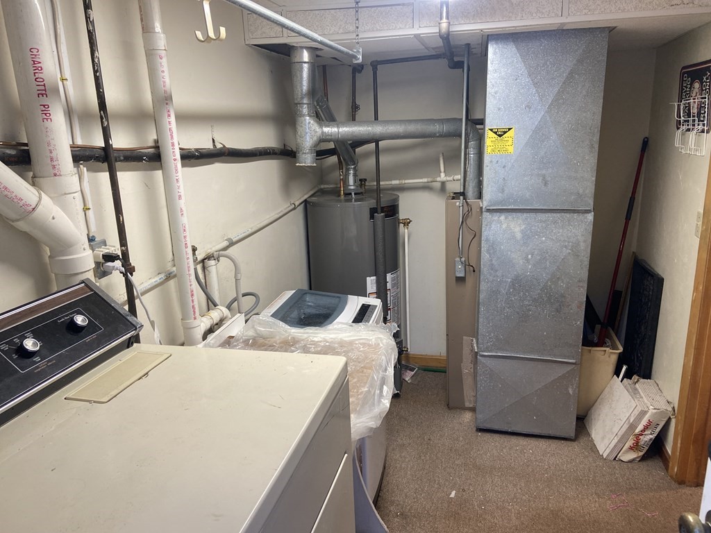 2 Fred Dolan Circle, Unit 2 Randolph, MA 02368 - Photo 25 of 25 a room with gym equipment and refrigerator