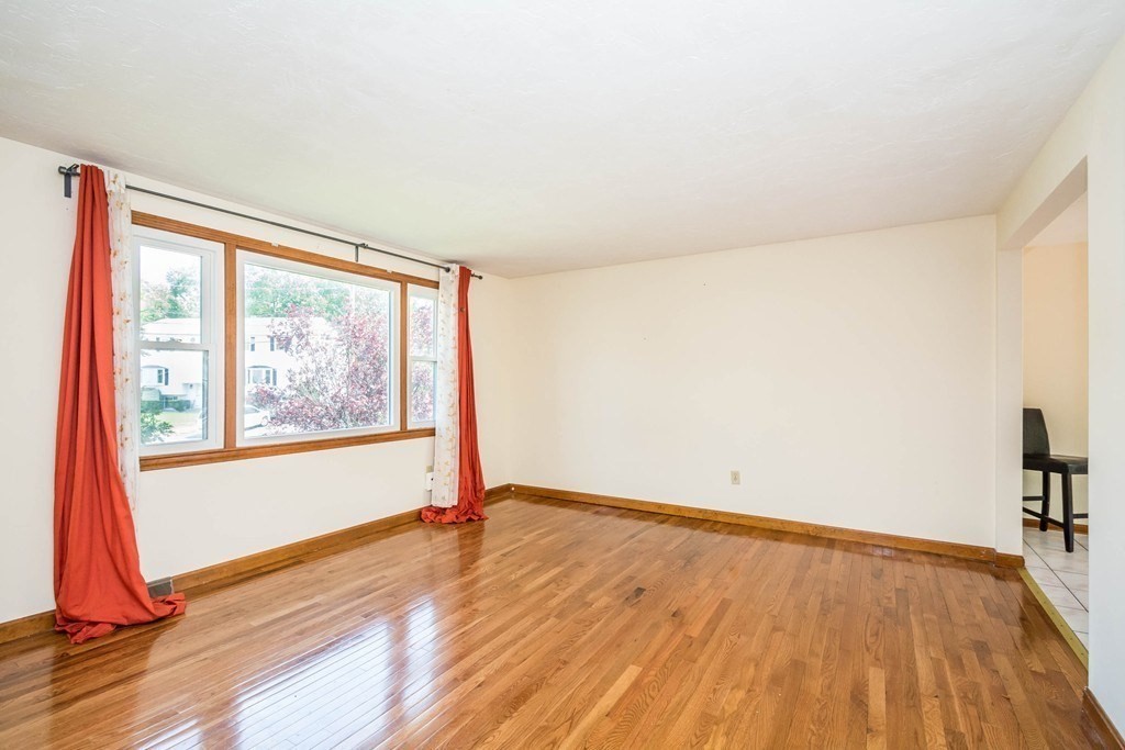 2 Fred Dolan Circle, Unit 2 Randolph, MA 02368 - Photo 8 of 25 a view of empty room with wooden floor and fan