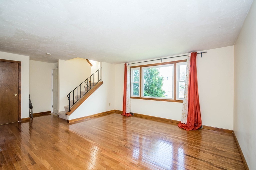 2 Fred Dolan Circle, Unit 2 Randolph, MA 02368 - Photo 10 of 25 a view of empty room with wooden floor and fan