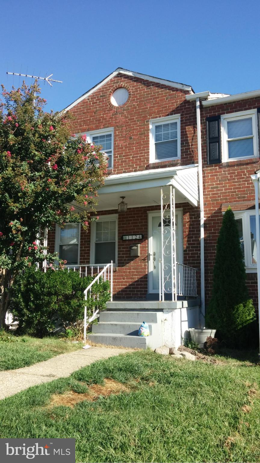 1124 Elm Road Baltimore, MD 21227 - Photo 1 of 13 a front view of a house with a yard